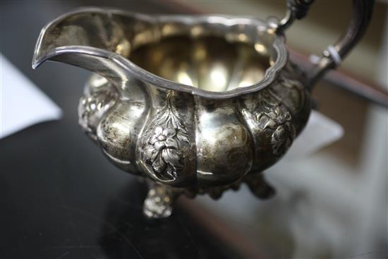 A William IV silver melon shaped two handled sugar bowl and matching cream jug, 20.5 oz.